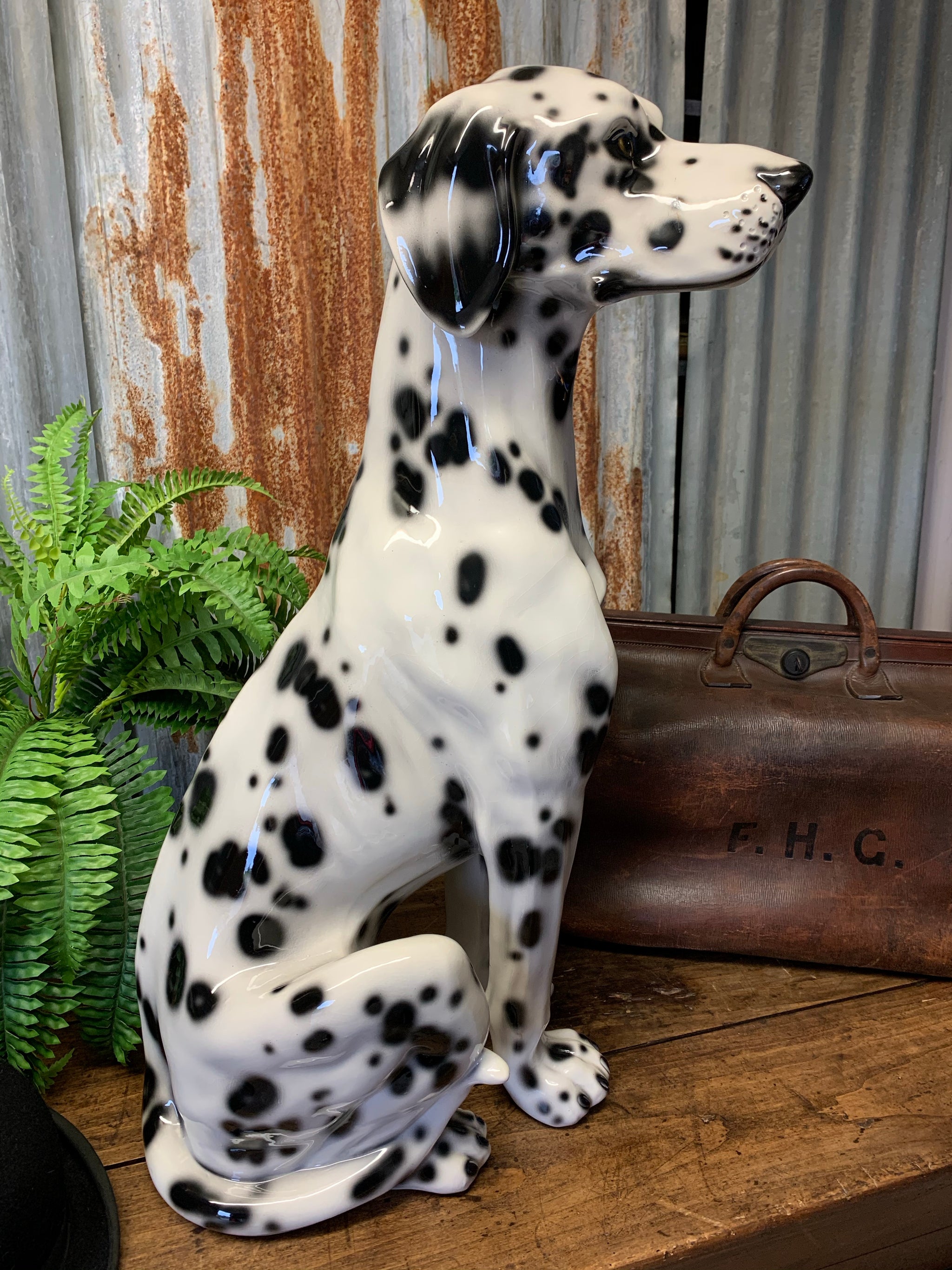 A large ceramic Dalmatian dog statue made by Ceramiche Boxer