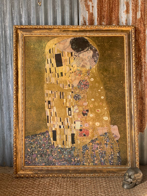 A large copy of The Kiss painting by Gustav Klimt