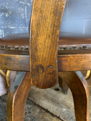 An oak rotating banker's desk chair