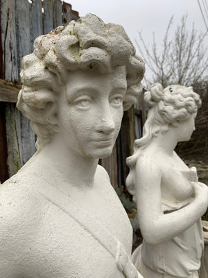 A very large pair of garden statues depicting Apollo and Diana