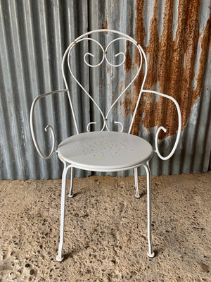 A set of four French white wire work garden chairs