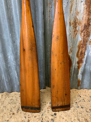 A pair of vintage wooden oars