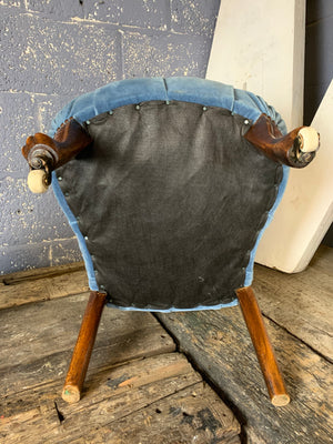 A blue velvet button back and seat Prie Dieu chair on castors