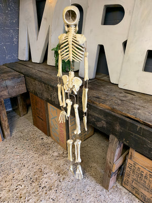 A papier-mâché skeleton model in the Dia de Muertos/calavera style