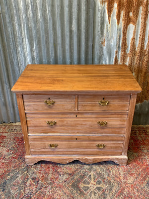 A limed tramline chest of drawers