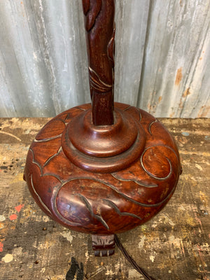An early 20th Century Chinese carved mahogany dragon table lamp