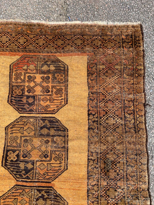 A gold Persian rectangular rug