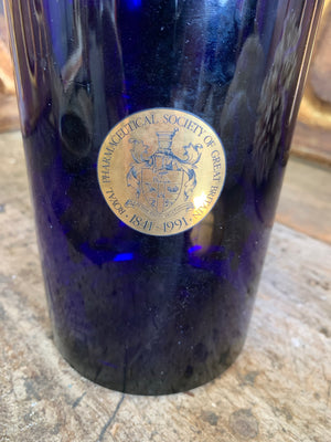 A blue glass myrrh apothecary jar by the Royal Pharmaceutical Society