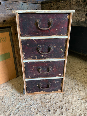 A wooden bank of four drawers