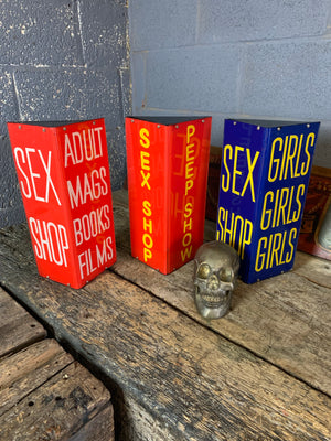 A red Sex Shop/Peep Show trade sign