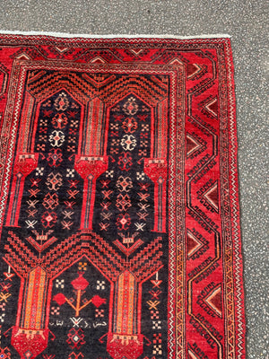 A red ground Persian rectangular rug with niche design- 239cm x 111cm