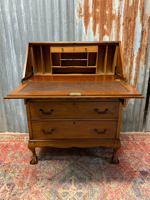 A Victorian style bureau with ball and claw feet