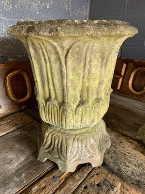 A pair of large lotus pattern cast stone urns