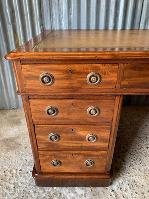 A Victorian tan leather pedestal desk on castors