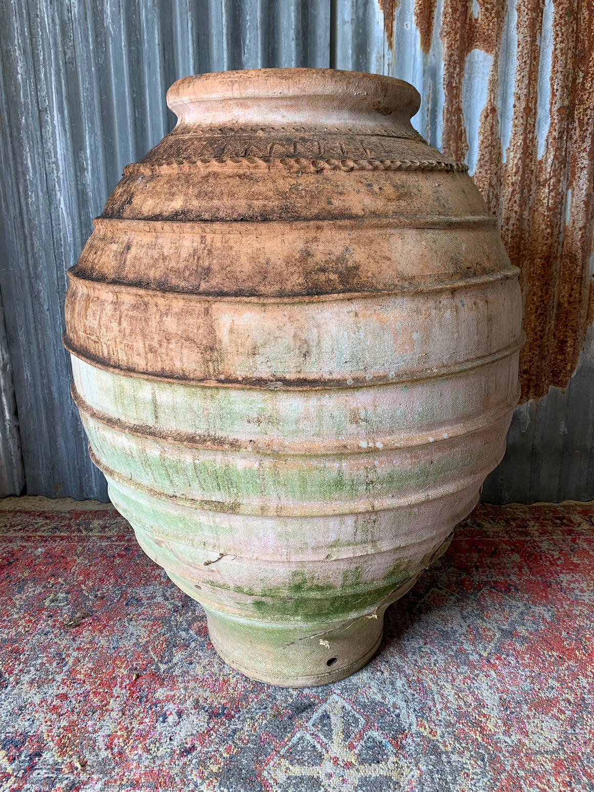 A very large beehive terracotta olive jar
