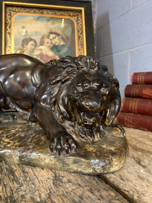 A large bronze effect plaster lion statue by Antoine Felix Boure