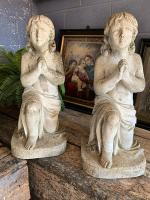 A pair of praying child angel garden statues in cast stone