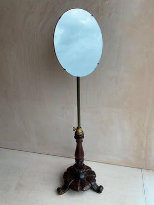 An adjustable gentleman's dressing mirror