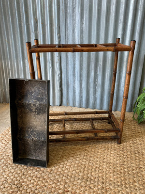 A bamboo stick stand with metal liner