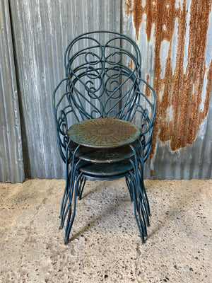 A set of four French blue wire work garden chairs