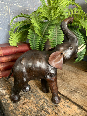 A brown leather elephant figure