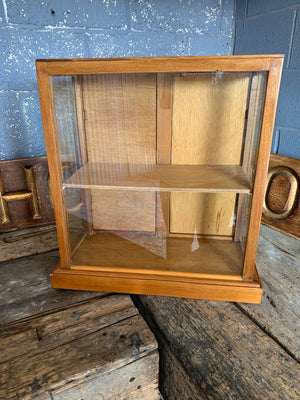 A glass table top shop display cabinet