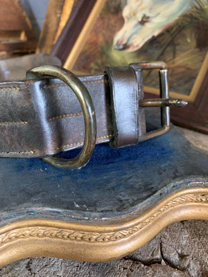 A very large old leather dog collar