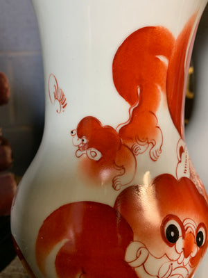 A pair of Chinese ceramic foo dog vases
