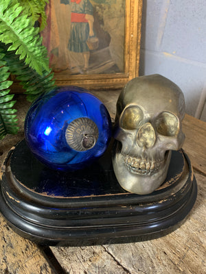 A blue glass witch's ball