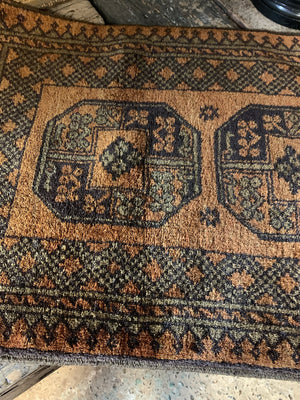 A Persian gold ground rectangular rug - 132 x 66cm