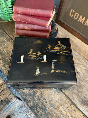 A Japanese black lacquered sewing box