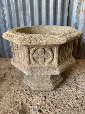 A pair of large Gothic font cast stone urns