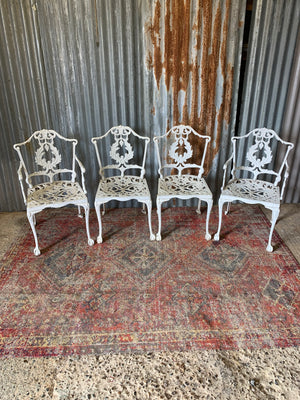 A white Regency style table and four chairs garden set