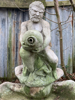 A Neptune stone garden fountain