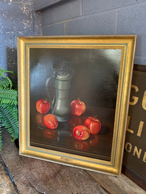 A large still life oil painting of apples and a tankard