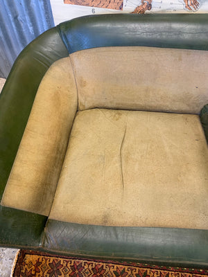 A large 3 seater Modernist Italian sofa in green leather of boat or 'egg' form