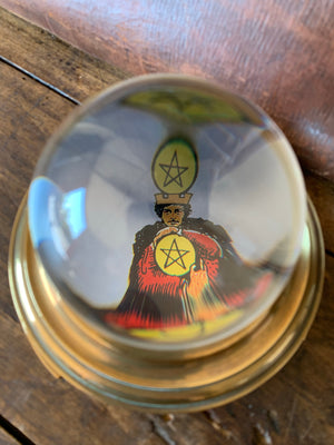 A fortune teller's crystal ball on a bronze base