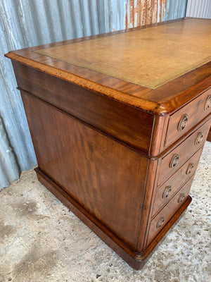 A Victorian tan leather pedestal desk on castors