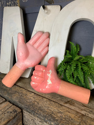 A large pink "thumbs up" fairground hand