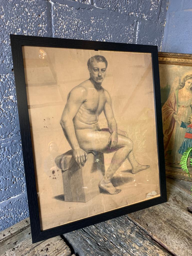 A 19th Century charcoal portrait of seated nude gentleman